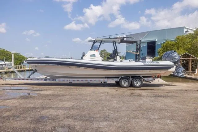 Slide: The Image of RIB CVL Colt 35 boat with dual engines cruising on open sea, 2018 model. - 5