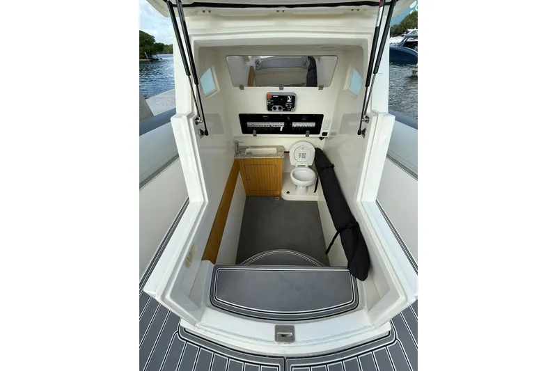 Slide: The Image of Interior of 2018 RIB CVL Colt 35 boat with compact bathroom and storage. - 51