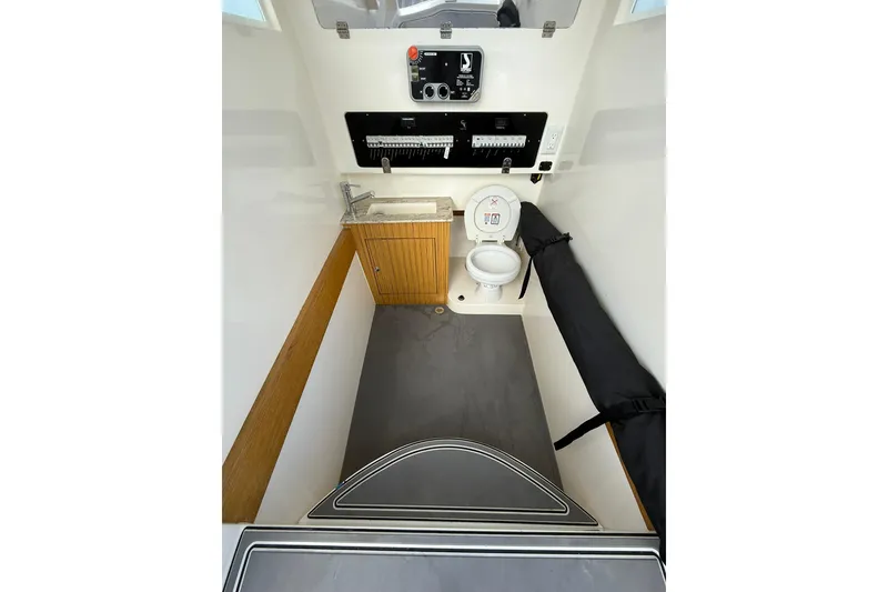 Slide: The Image of Interior of 2018 RIB CVL Colt 35 boat with toilet and control panel. - 52