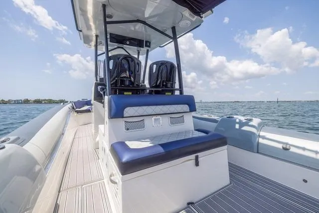 Slide: The Image of 2018 RIB CVL Colt 35 boat on water with canopy and Yamaha engine. - 7