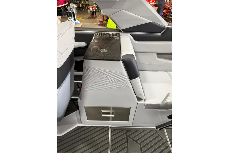 Slide: The Image of Interior of 2026 MasterCraft XStar 25 boat with sleek seating and storage. - 11