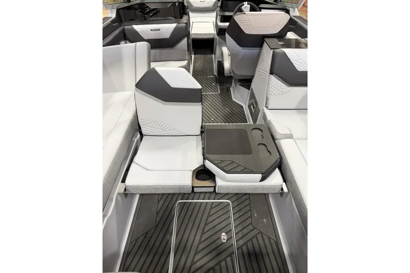 Slide: The Image of 2026 MasterCraft XStar 25 interior with modern seating and sleek design. - 12