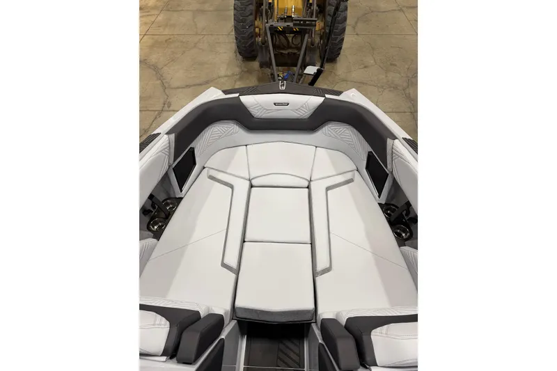 Slide: The Image of 2026 MasterCraft XStar 25 boat interior with sleek white seating and modern design. - 15