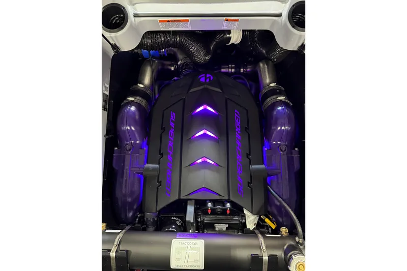 Slide: The Image of 2026 MasterCraft XStar 25 engine with illuminated supercharger cover. - 18