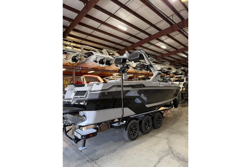 Slide: The Image of 2026 MasterCraft XStar 25 boat in a warehouse, showcasing sleek design and modern features. - 4