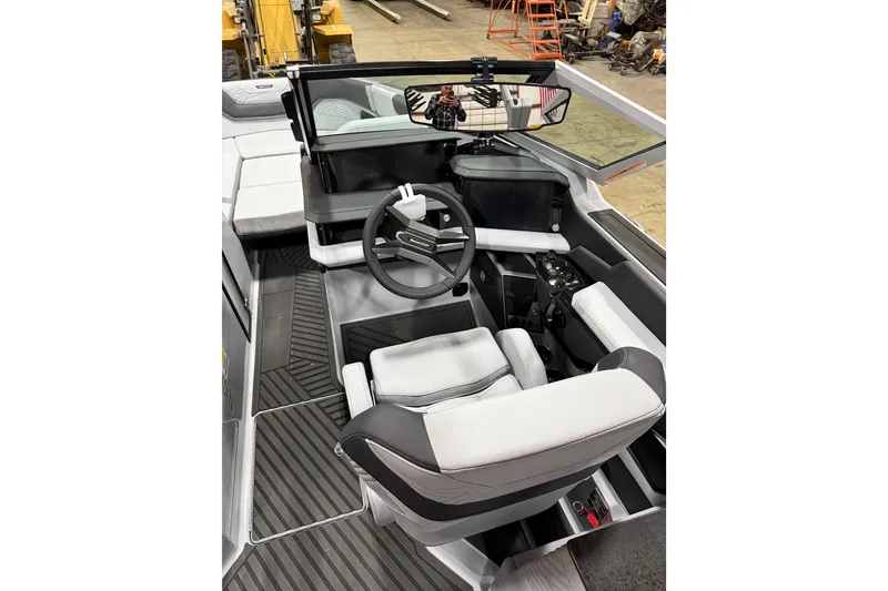 Slide: The Image of 2026 MasterCraft XStar 25 boat interior with modern steering and seating. - 8