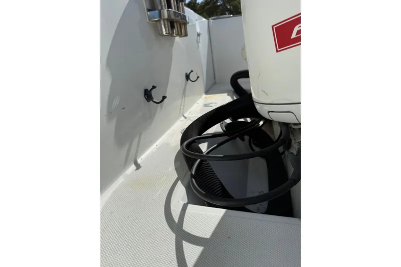 Slide: The Image of 2006 Buddy Davis 34 Center Console boat interior with cables and hooks visible. - 12