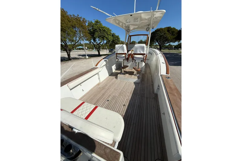 Slide: The Image of 2006 Buddy Davis 34 Center Console boat with spacious deck and seating. - 19