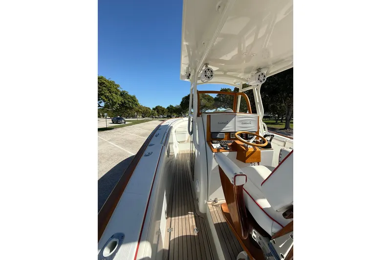 Slide: The Image of 2006 Buddy Davis 34 Center Console boat with sleek design and modern navigation equipment. - 22
