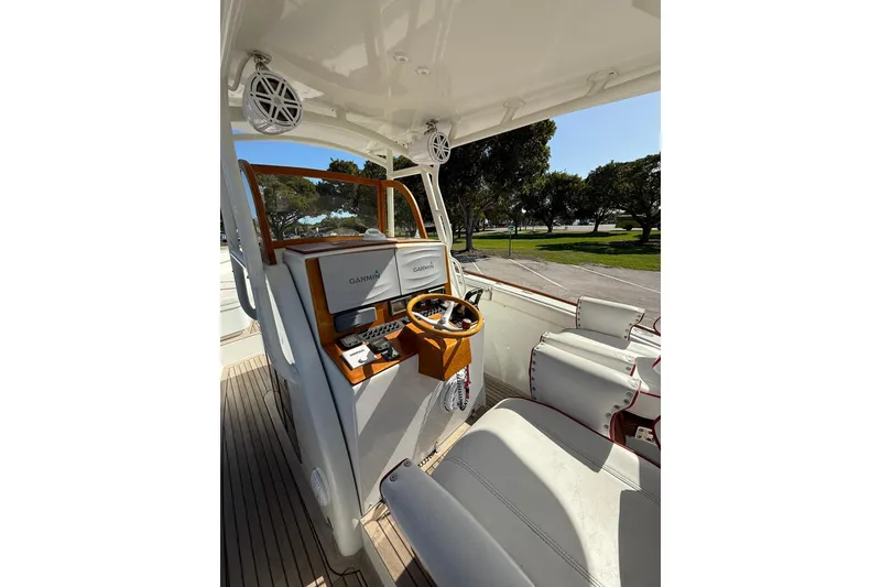Slide: The Image of 2006 Buddy Davis 34 Center Console boat interior with Garmin navigation system. - 24