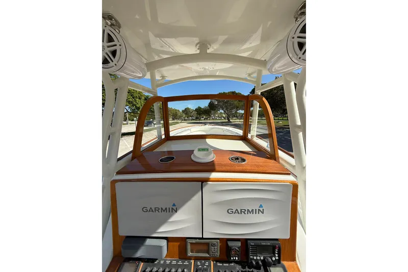 Slide: The Image of 2006 Buddy Davis 34 Center Console helm with Garmin navigation system and wood accents. - 27
