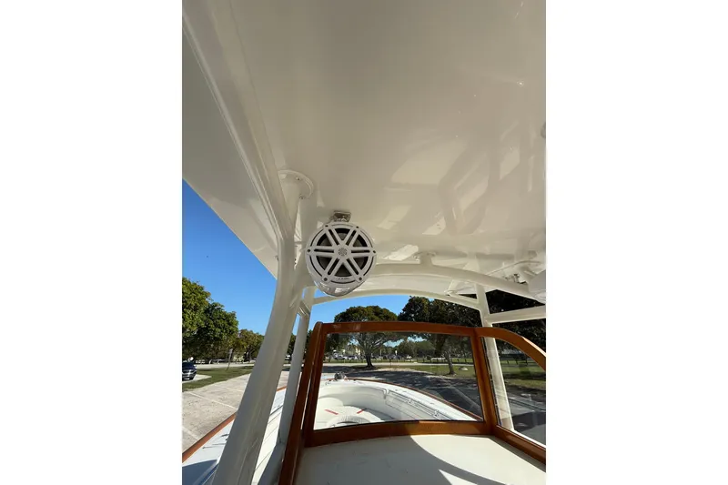 Slide: The Image of 2006 Buddy Davis 34 Center Console boat interior with speaker and wooden trim. - 29