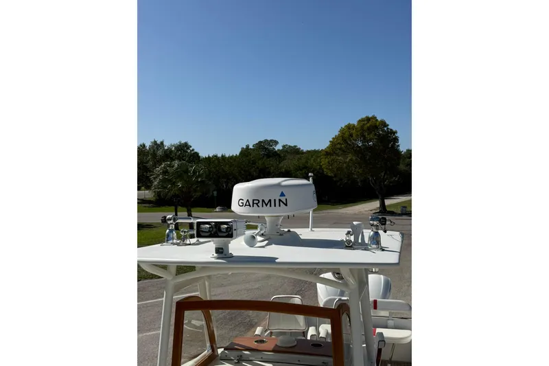 Slide: The Image of 2006 Buddy Davis 34 Center Console with Garmin radar, parked outdoors. - 49