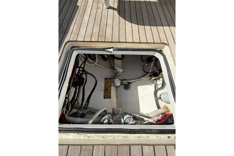 Slide: The Image of Open hatch of 2006 Buddy Davis 34 Center Console showing internal components and wiring. - 50