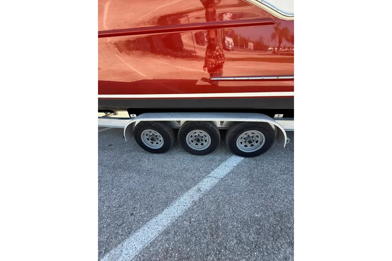 Slide: The Image of Trailer with triple axles for 2006 Buddy Davis 34 Center Console boat. - 52