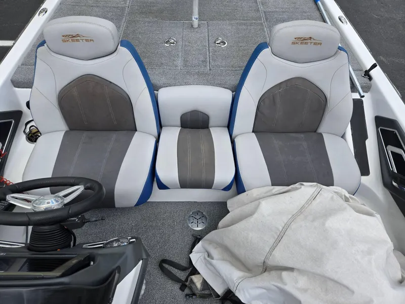 Slide: The Image of 2015 Skeeter FX 20 boat interior with dual gray and blue seats. - 21