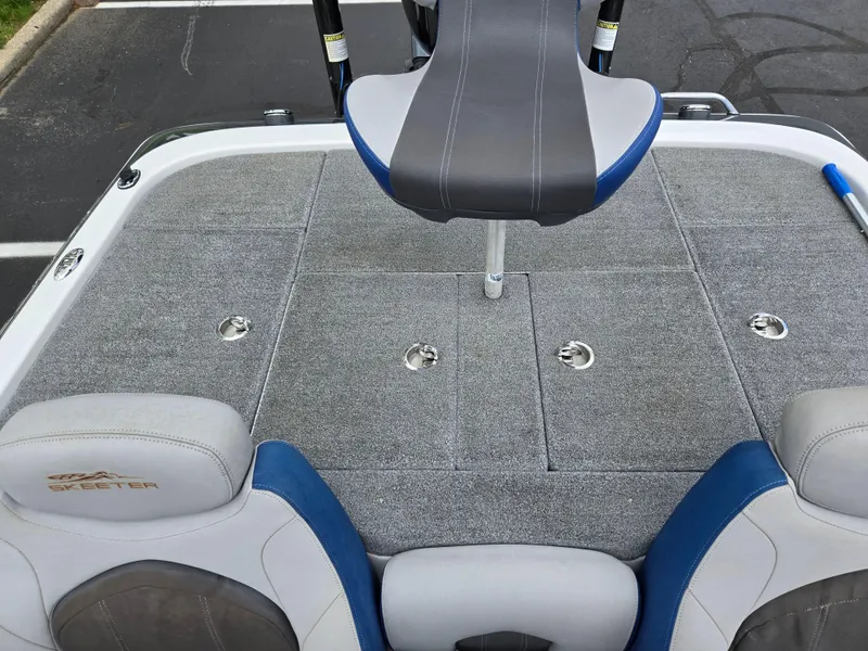 Slide: The Image of 2015 Skeeter FX 20 boat deck with seating and storage compartments. - 22