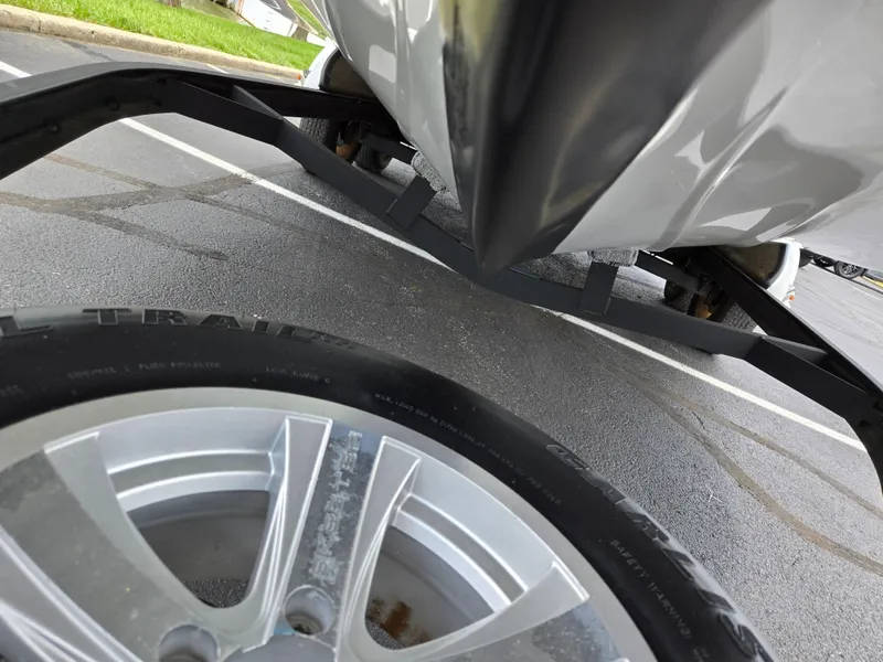 Slide: The Image of 2015 Skeeter FX 20 boat on trailer, close-up of hull and wheel. - 7