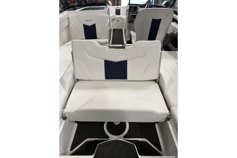 Slide: The Image of 2026 MasterCraft XT23 interior with white and navy seating, showcasing modern design and comfort. - 10