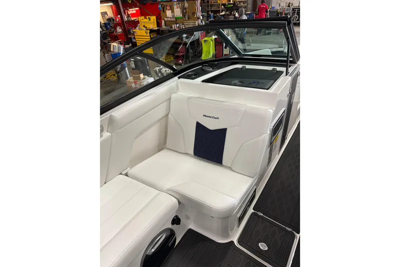 Slide: The Image of 2026 MasterCraft XT23 boat interior with white seating and modern design. - 6