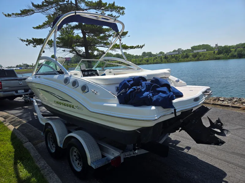 Slide: The Image of 2011 Chaparral 196 SSi boat on trailer by a lake, sunny day. - 1