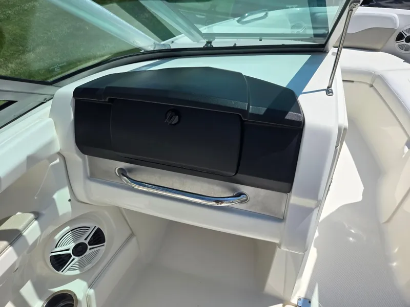 Slide: The Image of Interior view of 2011 Chaparral 196 SSi boat, featuring dashboard and speaker. - 13