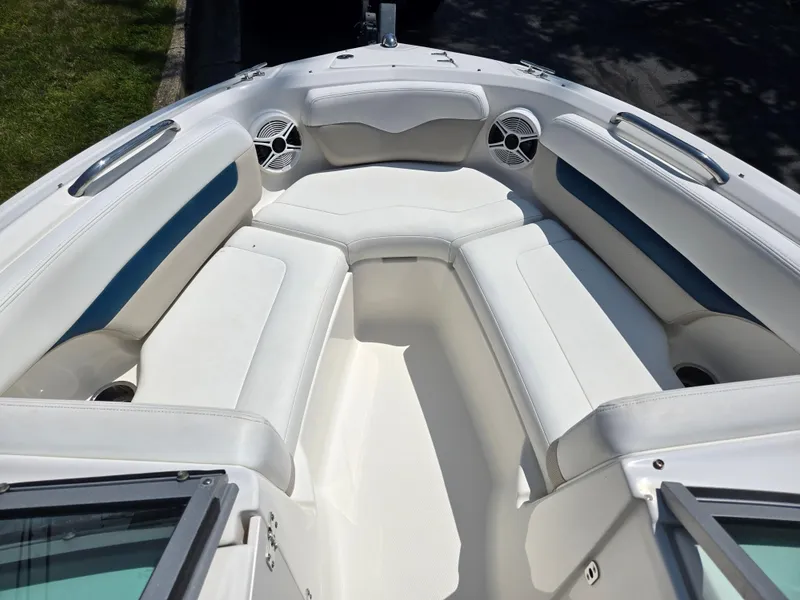 Slide: The Image of 2011 Chaparral 196 SSi boat interior with white seating and blue accents. - 18