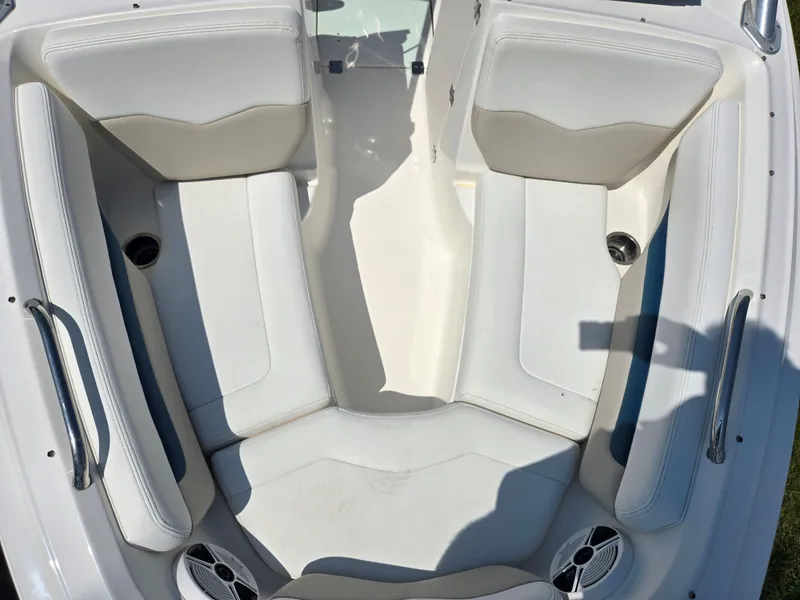 Slide: The Image of 2011 Chaparral 196 SSi boat interior with white seating and cup holders. - 20