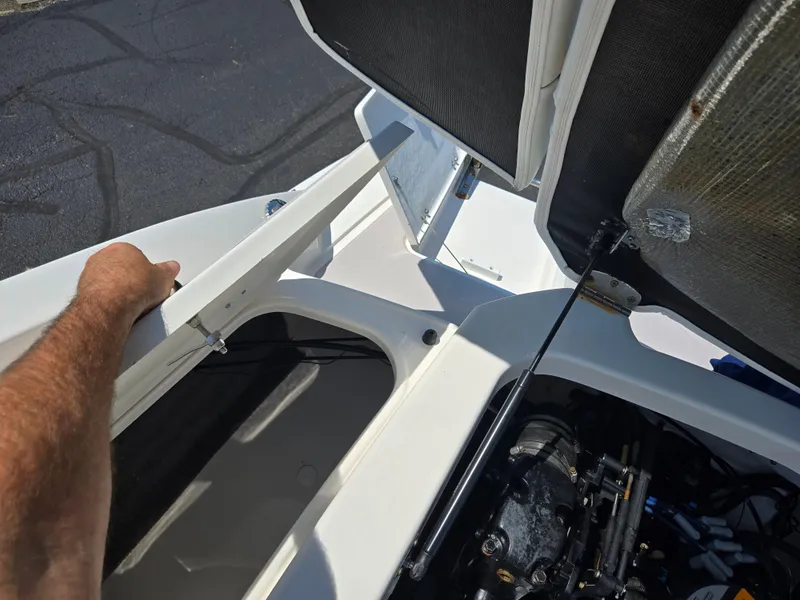 Slide: The Image of Open engine compartment of 2011 Chaparral 196 SSi boat, showing mechanical components. - 25