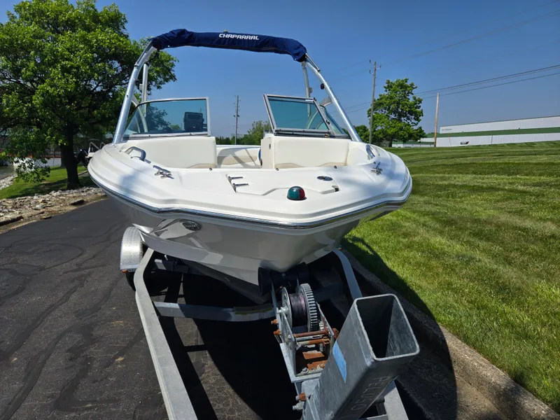 Slide: The Image of 2011 Chaparral 196 SSi boat on trailer, parked on a sunny day. - 6