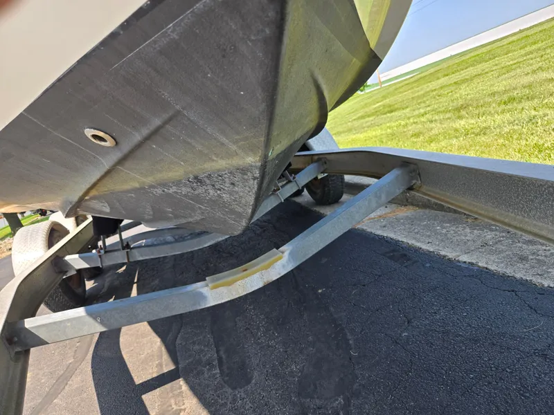 Slide: The Image of Underside view of a 2011 Chaparral 196 SSi boat on a trailer. - 7