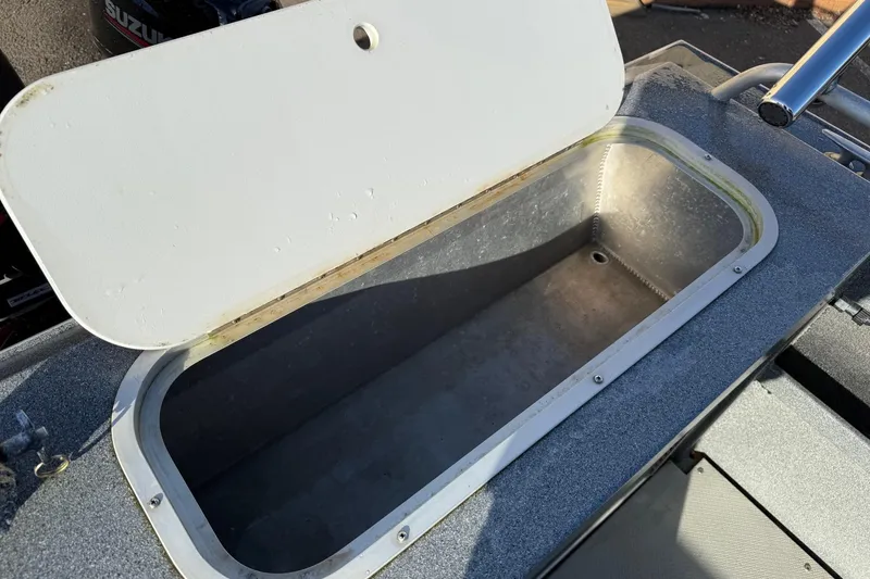 Slide: The Image of Open storage compartment on a 2016 North River Seahawk boat. - 11