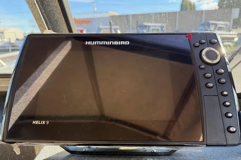 Slide: The Image of Humminbird Helix 9 fish finder on 2016 North River Seahawk boat dashboard. - 16