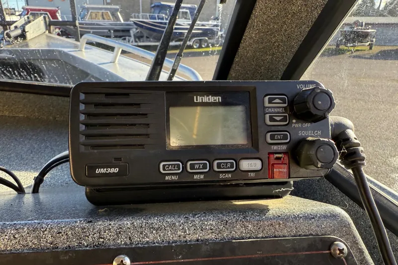 Slide: The Image of Uniden UM380 radio on 2016 North River Seahawk boat dashboard. - 17