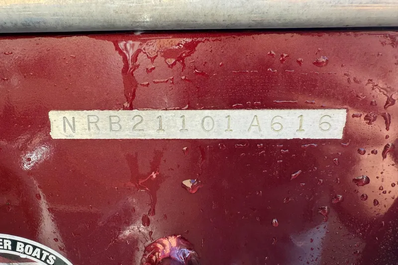 Slide: The Image of 2016 North River Seahawk boat hull identification number on wet red surface. - 19