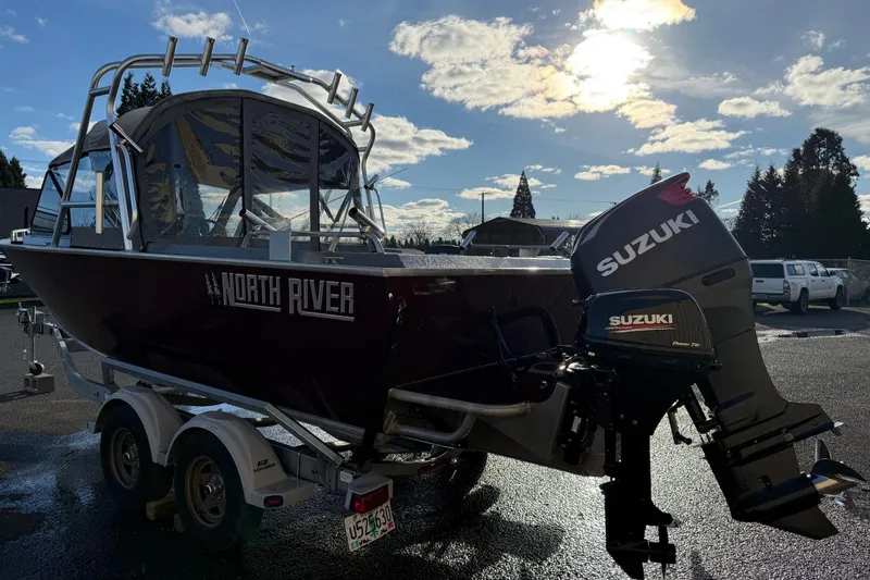 Slide: The Image of 2016 North River Seahawk boat with Suzuki outboard motor on a trailer. - 3