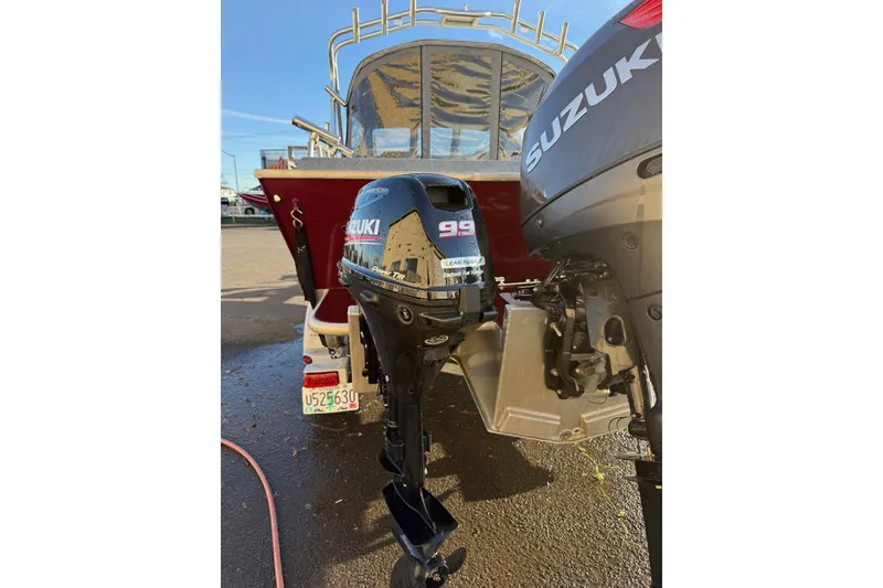 Slide: The Image of 2016 North River Seahawk with Suzuki outboard motor, parked on a sunny day. - 7