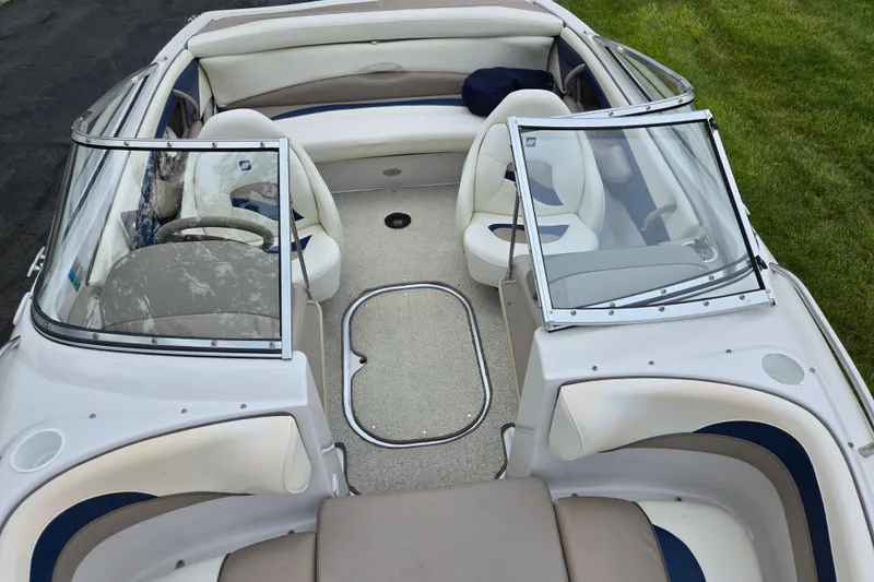Slide: The Image of Interior of a 1998 Four Winns 180 Horizon boat with seating and windshield. - 19