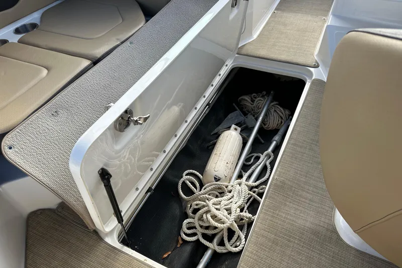 Slide: The Image of Storage compartment in 2020 Sea Ray SPX 190 Outboard with ropes and equipment. - 14