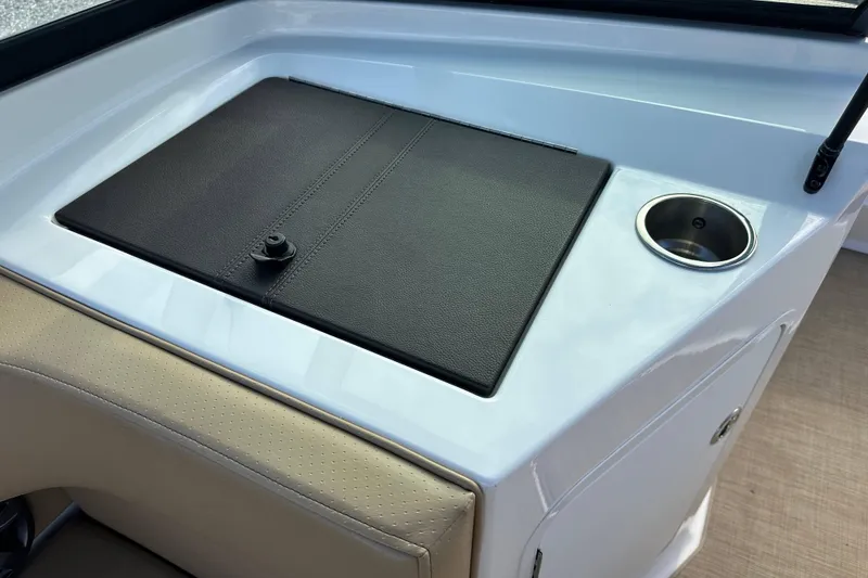 Slide: The Image of 2020 Sea Ray SPX 190 Outboard boat console with cup holder and storage compartment. - 17