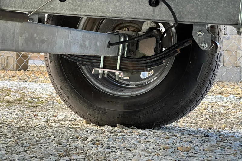 Slide: The Image of Trailer wheel and suspension of a 2020 Sea Ray SPX 190 Outboard boat. - 19