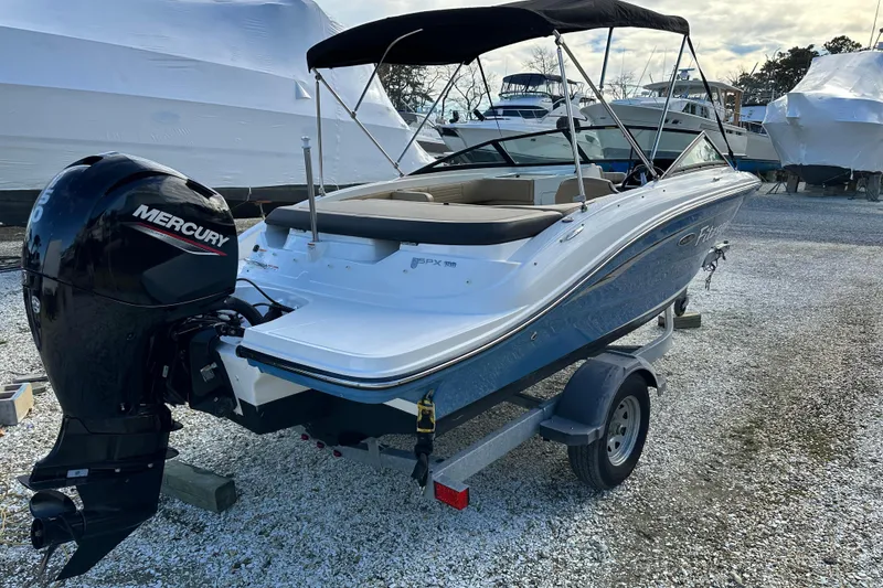 Slide: The Image of 2020 Sea Ray SPX 190 Outboard boat with Mercury engine on trailer. - 2