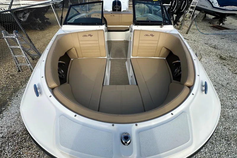 Slide: The Image of 2020 Sea Ray SPX 190 Outboard boat with tan seating and open bow design. - 20