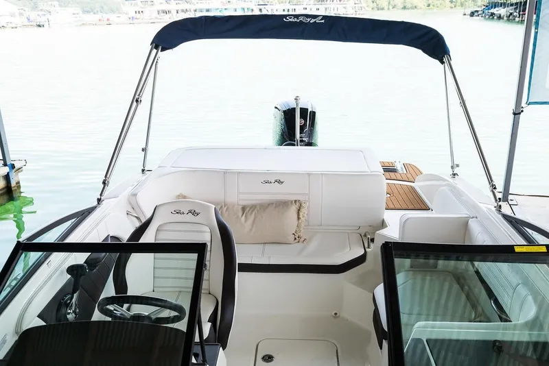 Slide: The Image of Manufacturer Provided Image: 2020 Sea Ray SPX 190 OB boat interior with seating and steering wheel. - 27