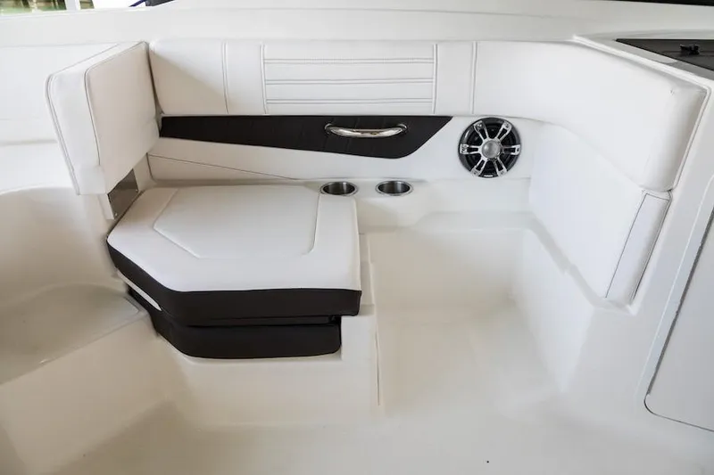 Slide: The Image of Manufacturer Provided Image: 2020 Sea Ray SPX 190 OB boat interior seating with cup holders and speaker. - 29