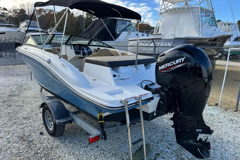 Slide: The Image of 2020 Sea Ray SPX 190 Outboard boat with Mercury engine, parked on a trailer. - 3
