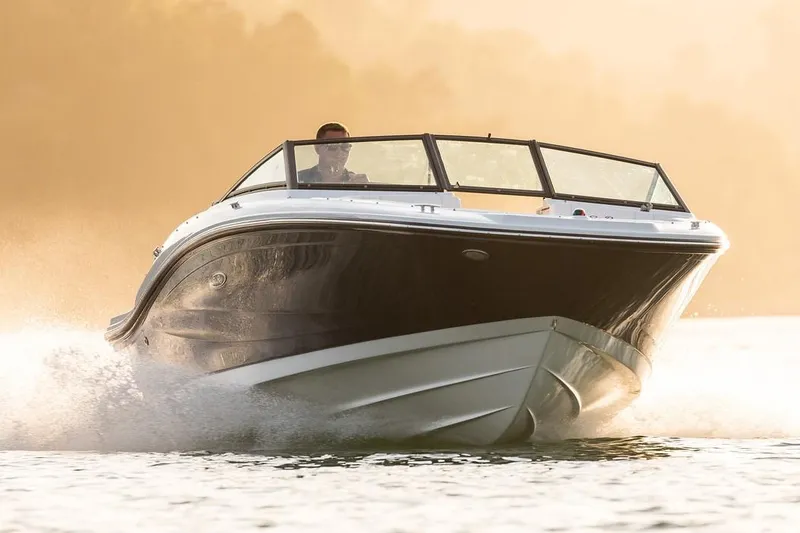 Slide: The Image of Manufacturer Provided Image: 2020 Sea Ray SPX 190 OB boat cruising on water at sunset. - 4