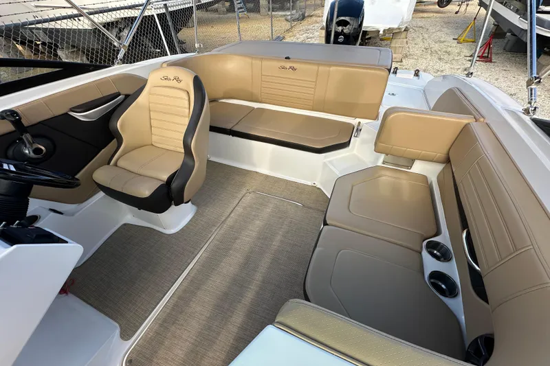 Slide: The Image of 2020 Sea Ray SPX 190 Outboard interior with tan seating and modern design. - 8