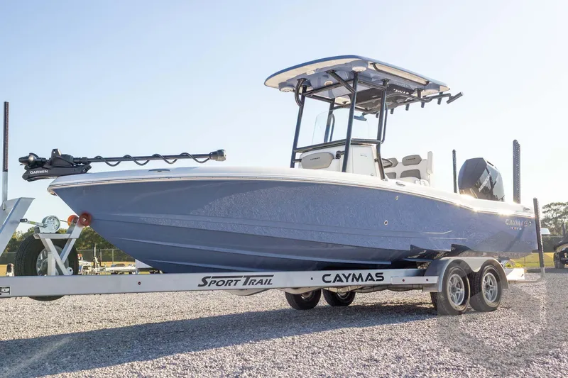Slide: The Image of 2026 Caymas 26 HB boat on trailer, featuring sleek design and modern equipment. - 12