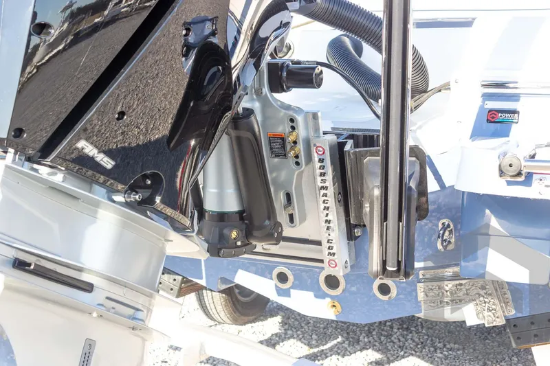 Slide: The Image of 2026 Caymas 26 HB boat engine and hydraulic system close-up. - 22